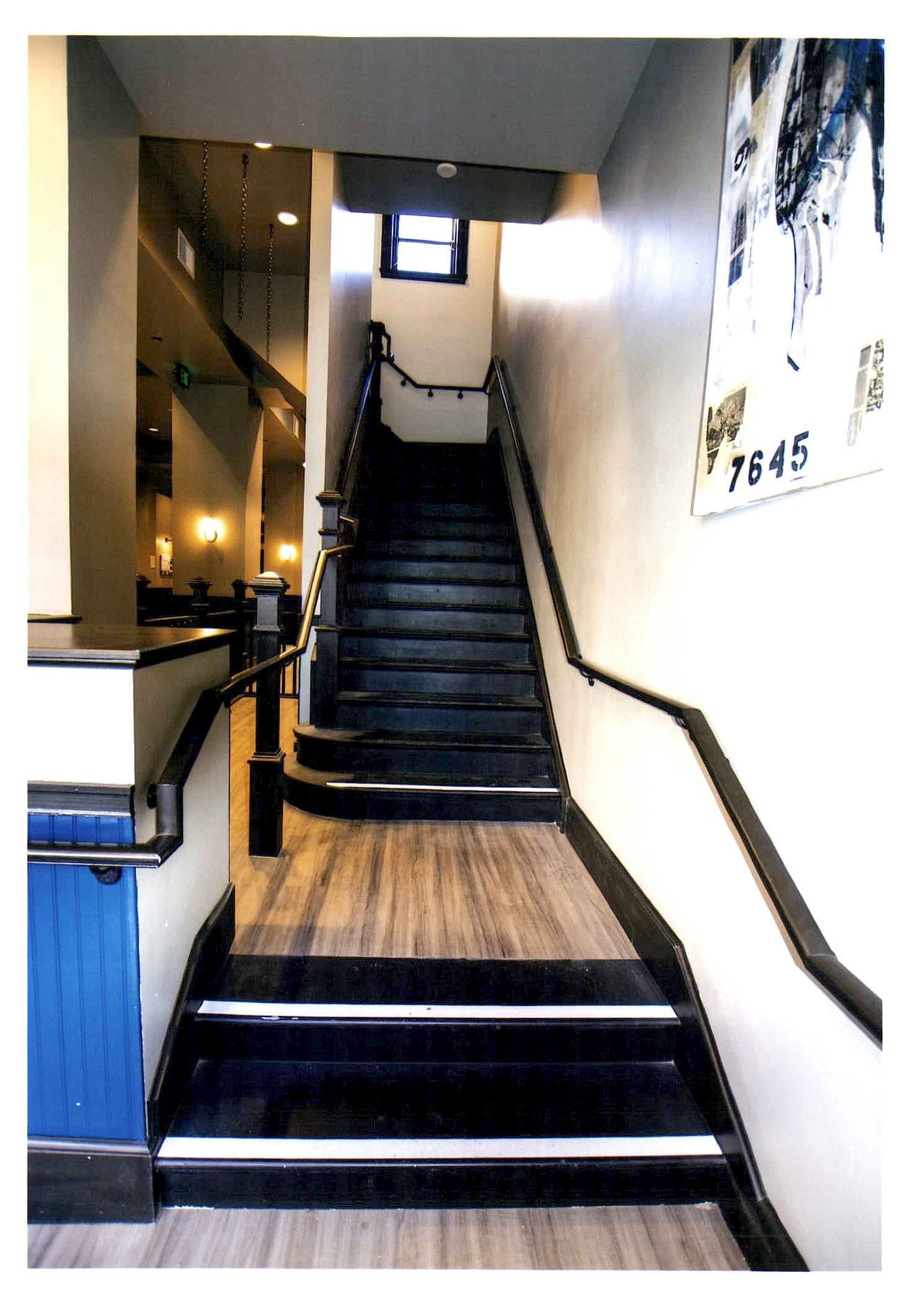 After: view of the main stair opposite the lobby entrance. Elevator is to the left.
